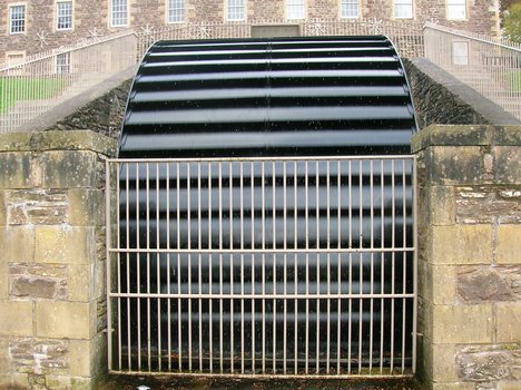 A back shot waterwheel at New Lanark World Heritage Site, Scotland.Overshot wheels demand exact engineering and significant head, which usually means significant investment in constructing a dam, millpond and waterways.