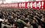 In this Korean Central News Agency photo released by Korea News Service in Tokyo on Tuesday, Jan. 6, 2009, tens of thousands of North Koreans pump their fists in unison during a rally Monday, Jan. 5, 2009 at Pyongyang's main Kim Il Sung plaza in a display of might and loyalty that underscored the regime's guiding 