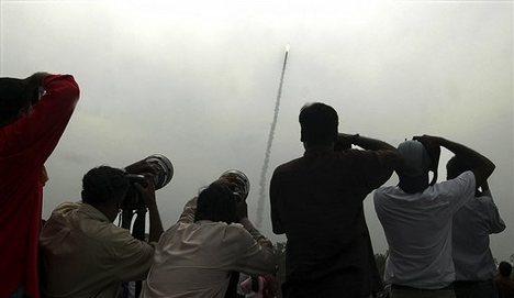 Photographers try to capture India's Polar Satellite Launch Vehicle (PSLV) C-9 blasting off from the Satish Dhawan Space Center at Sriharikota, around 80 kilometers (50 miles) north of Chennai, India, Monday April 28, 2008. Setting a world record, India's Polar rocket Monday successfully placed ten satellites, including the country's remote sensing satellite, into orbit in a single mission according to a news report