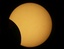 The partial solar eclipse is seen, pictured through the telescope of the observatory of the University of Applied Science in Kiel, northern Germany, on Friday, Aug. 1, 2008.