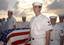 Sailors prepare to commit to the sea the body of Machinist's Mate 3rd Class Nathan Taylor during a Burial at Sea.