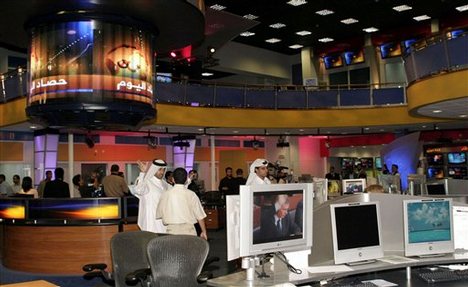 Al Jazeera Channel -Representatives of media look around in Al Jazeera´s new news room on in Doha, Qatar, Wednesday, June 15, 2005. Al-Jazeera is nothing if not bold. Its freewheeling broadcasts have decimated state-run TV stations across much of t