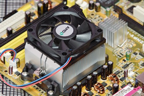 Figure 1: An active (fan cooled) heat sink used for the processor cooling in the consumer PC market. To its right is a smaller pin fin heat sink used to cool the Northbridge of the PC motherboard.