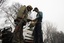 An Indian policeman searches a Kashmiri man at a checkpoint ahead of India's Republic Day celebrations in Srinagar January 22, 2010. Keeping in view the recent surge in separatist violence security checking, frisking of people and patrolling have been stepped up in Kashmir ahead of Republic Day which falls on January 26, an Indian police officer said.