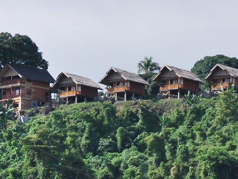 APRIL 10 , 2008 , ZAMBOANGA PROVINCE , PHILIPPINES - NIPA HUT HOUSES ON TOP OF CABIGAN MOUNTAIN