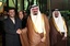 FILE - In this Nov. 17, 2007 file photo, Iran's President Mahmoud Ahmadinejad, left, shakes hands with Saudi Arabia's King Abdullah, second from right, as Crown Prince Sultan, right, looks on at Riyadh airport, shortly after Ahmadinejad arrived to attend the Organization of the Petroleum Exporting Countries (OPEC) summit in Riyadh, Saudi Arabia. The classified diplomatic cables released by online whistle-blower WikiLeaks and reported by the London Guardian said some cables showed King Abdullah of Saudi Arabia repeatedly urging the United States to attack Iran to destroy its nuclear program.