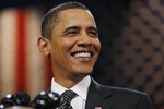 President Barack Obama smiles during a town hall style meeting at the University of Tampa's Bob Martinez Sports Center in Tampa, Fla., the day after his State of the Union speech, Thursday, Jan. 28, 2010.