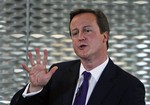 British Conservative party leader David Cameron gestures as he delivers a speech at Imperial College in central London, Thursday, June 25, 2009.