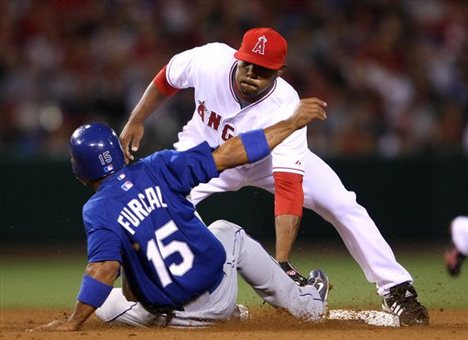 Los Angeles Dodgers' Rafael Furcal is tagged out by Los Angeles Angels' Howie Kendrick