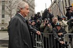 Bernard Madoff exits Manhattan federal court, Tuesday, March 10, 2009, in New York. Madoff will plead guilty Thursday to 11 criminal counts including money laundering, perjury and securities, mail and wire fraud and will do so without a plea deal, knowing it carries a potential prison term of 150 years, lawyers said Tuesday in court.