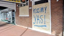 Message written on a boarded up shopfront in Cairns ahead of the arrival of Cyclone Yasi