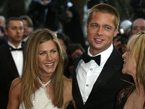 Brad Pitt, right, and his wife Jennifer Aniston arrive for the screening of the film 