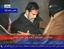  This video image released by Iraqi state television shows Saddam Hussein&acute;s guard wearing a ski mask and leading the deposed leader to the gallows moments before his execution Saturday Dec. 30. 2006. Clutching a Quran and refusing a hood, Saddam Hus