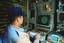 A crew member monitors the SLQ-32 radar warning system console aboard the battleship USS Iowa.