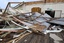 A senior citizen's center is destroyed in Tully, Australia, Thursday, Feb. 3, 2011, after Cyclone Yasi brought heavy rain and howling winds gusting to 186 mph (300 kph).