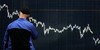 A man talks on his phone as he stands in front of a financial display board in central London, Monday, Oct. 6, 2008. Share prices on the London Stock Exchange closed sharply down Monday with the FTSE 100-share index closing down 391.06 points at 4,589.19. Asian and European stock markets plunged as government bank bailouts in the U.S. and Europe failed to alleviate fears that the global financial crisis would depress world economic g