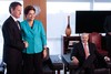 U.S. Treasury Secretary Timothy Geithner, left, shakes hands with Brazil's President Dilma Rousseff, center, as they pose for pictures during a meeting in Brasilia, Brazil, Monday, Feb. 7, 2010. Geithner traveled to Brazil to meet with top officials Monday, looking to bolster ties ahead of next month's visit by President Barack Obama and foster teamwork on economic issues such as confronting China on its currency. At right, Brazil's Economy Minister Guido Mantega.