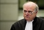 Prosecutor Daniel Bellemare of Canada looks up in the court room of the Hariri tribunal in Leidschendam, Netherlands, Monday Feb. 7, 2011. Lawyers and judges at a U.N.-backed tribunal  are trying to thrash out the question of what constitutes an act of terrorism, and other legal issues, as they prepare to prosecute suspects for the assassination of former Lebanese Prime Minister Rafik Hariri. A hearing at the Special Tribunal for Lebanon  (STL) is aimed at clarifying laws the court will apply to those allegedly responsible for the truck bomb that killed Hariri and 22 others in Beirut on Feb. 14, 2005.