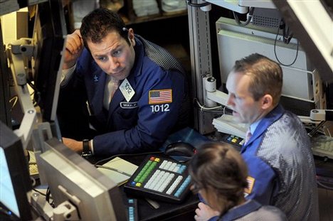 Michael Pistillo Jr., left, and Patrick Kenny, both of Barclays Capital, work at their post on the floor of the New York Stock Exchange Wednesday, Feb. 18, 2009, in New York.