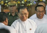 Senior General Than Shwe, the top leader in Myanmar, center and Lt. General Soe Win, who is the current Prime Minister, right, are seen following ceremonies at the Fourth Buddhism World Summint in Yangon Thursday, Dec. 9, 2004. Hundreds of prisoners, including two pro-democracy leaders, have been released from Myanmar prisons as a part of a broad amnesty granted by the country's ruling junta. Most were released from Yangon's Insein prison. There was on indicaton that opposition leader Aung San Suu Kyi would be freed from house arr