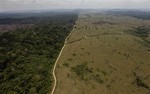 In this Sept. 15, 2009 photo, a deforested area is seen near Novo Progresso in Brazil's northern state of Para. The Brazilian Amazon  is arguably the world's biggest natural defense against global warming, acting as a "sink," or absorber, of carbon dioxide. But it is also a great contributor to warming. About 75 percent of Brazil's emissions come from rainforest clearing, as vegetation burns and felled trees rot.