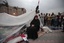 Egyptian anti-government demonstrators pray in Tahrir Square, the center of anti-government demonstrations, in Cairo, Egypt, Monday, Feb. 7, 2011.