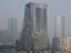 Mandarin Oriental hotel which was destroyed by fire, center, is seen in the central business district in Beijing, China, Tuesday, Feb. 10, 2009. One fireman was killed fighting a blaze that destroyed a 44-story luxury hotel being constructed as part of Beijing's frenetic Olympic makeover and next door to a landmark television headquarters in downtown Beijing, state media reported Tue