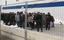 Would-be migrants believed to be from Tunisia are gathered at the port of the Sicilian island of Lampedusa, Italy, Friday, Feb. 11, 2011 after arriving there by boat. Some 1,000 Tunisians have fled the chaos in their homeland and arrived by boat on a tiny Italian island, prompting Italy to demand Friday that the European Union take stronger action to prevent an uncontrolled wave of migrants from North Africa. Since Jan. 16, about 1,600 Tunisians have landed in Italy, the U.N. refugee agency says, mostly on the island of Lampedusa, which is closer to Africa than the Italian mainland. Half of them arrived in recent days.