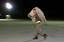 A lone airman carries part of a TEMPER (Tent, Extendable, Modular, Personnel) tent section to its construction location, soon to be part of the new dining facility tent, while deployed at an undisclosed location in support of Operation ENDURING FREEDOM. I