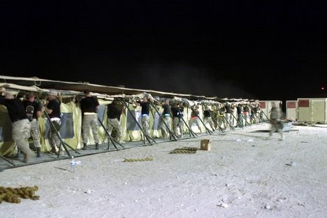 Members of the 366th Civil Engineering Squadron, Mountain Home AFB, Idaho, raise part of the TEMPER (Tent, Extendable, Modular, Personnel) tent wall, soon to be the new dining facility tent while deployed at an undisclosed location in support of Operation