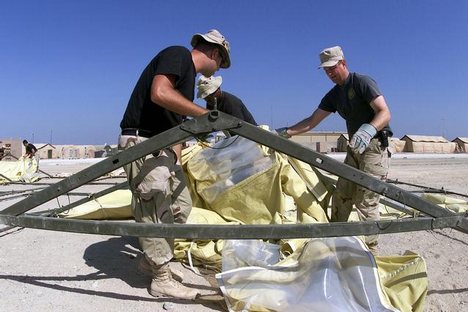 Air Force members assigned to the 355th AEG (Air Expeditionary Group) assemble TEMPER (Tent Extendable Modular Personnel) tent frames at Masirah Air Base, Oman. The tents will be shelters for incoming troops deployed in support of Operation ENDURING FREED