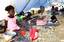 Displaced Haitians not yet assigned individual tents share a large tent house at a new camp site in Croix des Bouquets, Haiti.