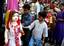 Kashmiri Muslim children look at garments while shopping ahead of the Muslim religious festival of Eid-ul-Fitr in Srinagar, the summer capital of Indian Kashmir, 19 September 2009. Eid-ul-Fitr is a religious festival of Muslims, which marks the end of Ramadan, the Islamic holy month of fasting and symbolizes the breaking of the fasting period