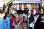 Kashmiri Muslim children look at garments while shopping ahead of the Muslim religious festival of Eid-ul-Fitr in Srinagar, the summer capital of Indian Kashmir, 19 September 2009. Eid-ul-Fitr is a religious festival of Muslims, which marks the end of Ramadan, the Islamic holy month of fasting and symbolizes the breaking of the fasting period