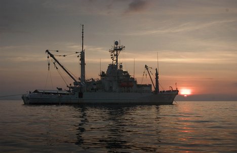 The rescue and salvage ship USS Salvor (ARS 52) at anchor off the coast of Indonesia to conduct familiarization dives with Indonesian Navy divers.