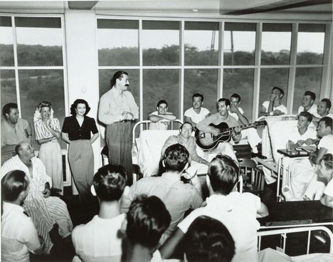 Entertainers Bob Hope and Francis Langford entertaining patients at the Coco Solo Hospital