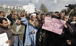 Bus drivers strike at a bus depot in the lower-income neighborhood of Shubra Mazalat in Cairo, Egypt Thursday, Feb. 10, 2011.