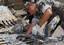 Chief Explosive Ordnance Disposalman Duane Oliveira, assigned to Explosive Ordnance Disposal Mobile Unit (EODMU) 8 checks the breach and renders safe of an .50 caliber machine gun.