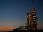 Dawn broke over the Atlantic Ocean near Launch Pad 39A at NASA's Kennedy Space Center in Florida to reveal space shuttle Discovery newly arrived for its upcoming launch in this image taken on Feb. 1, 2011. Discovery began its 3.4-mile trip from the Vehicle Assembly Building at 7:58 p.m. EST Jan. 31, and was secured on the pad a little before 3 a.m. Feb. 1. Discovery is set to launch to the International Space Station on the STS-133 mission on Thursday, Feb