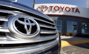 FILE - In this April 13, 2008 file photo, the company logo shines off the grille of an unsold 2008 Avalaon sedan at a Toyota dealership in the southeast Denver suburb of Centennial, Colo.Toyota Motor Sales (TMS), U.S.A., Inc., Friday, May 1, 2009, reported month-end sales of 126,540 vehicles, a decrease of 41.9 percent from last April, on a daily selling rate basis.