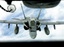 An FA 18 Hornet approaches to get airborne refueling from a KC 10 Tanker  of U.S. Airforce 2nd Air Refuelling Squadron, based in Andersen Air Force Base in Guam, during the "Valiant Shield 06" exercises in the Pacific Ocean, off Guam coast, Friday, June 23, 2006. The largest U.S. military exercise in the Pacific since the Vietnam War ended Friday after demonstrating to North Korea and other nations in the region the United States' ability to "quickly amass" a huge combat force should the need arise, officials said. The five-day "Valiant Shield" exercises brought together an armada of three aircraft carriers and 25 other ships, along with 22,000 troops and 280 warplanes, off this tiny island in the western Pacific.