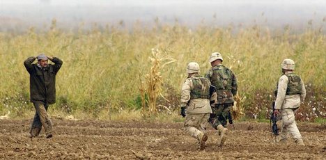 US Army (USA) members of the 173rd Airborne Brigade (AB BDE) move in to secure a suspected Ba'ath party bomb maker on the outskirts of Al Hawijah as part of Operation Bayonet Lightning during Operation IRAQI FREEDOM. Bayonet Lightning is a 173rd Brigade l