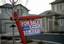 A for sale sign stands in front of a bank-owned home in Las Vegas in Las Vegas, Friday, Feb. 8, 2008. In states hardest-hit by the housing bust, foreclosed homes represent a growing share of homes sold, and that number has risen above 50 percent lately in particularly hard-hit cities.