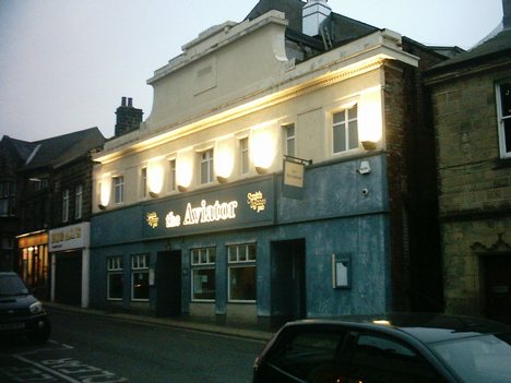 The Aviator public house, reflecting the towns aviation heritage. Yeadon has a developed town center and most of the businesses are situated around the High Street. There is a Morrison's supermarket as well as several other chain shops, banks, building societies, estate agents and public houses.