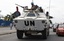 Jordanian United Nations soldiers drive in a U.N. armored personnel carrier, in Abidjan, Ivory Coast, Tuesday, March 1, 2011. U.N. vehicles are rarely visible on the street's of Ivory Coast's biggest city, where roadblocks manned by armed militants block access to many neighborhoods and supporters of Laurent Gbagbo have been given free reign to not only attack pro-Ouattara neighborhoods, but also U.N. peacekeepers.