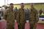 Vice Chairman of the Joint Chief of Staff Marine Gen. James Cartwright takes time for a picture with Camp Lemonier's Command Master Chief Gary Donner, left, and Executive Officer Cmdr. David Williams during Cartwright's USO morale visit.