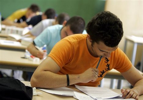 A student writes the Italian essay during the first day of the maturita' exams