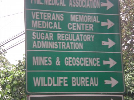 STREET SIGN GOING TO PHIL. MEDICAL ASSOCIATION , VETERANS MEMORIAL MEDICAL CENTER , SUGAR REGULATORY ADMINISTRATION , MINES & GEOSCIENCE AND WILDLIFE BUREAU ALONG DILIMAN , QUEZON CITY , PHILIPPINES. PHOTO TAKEN : JUNE 4 , 2008