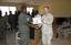 Captain John Q. Dal Santo, J9 Director, Combined Joint Task Force Horn of Africa, presents a counter-terrorism training completion certificate to Djiboutian army soldier Ibrahim Mohamed Kamil.