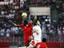 Bahrain's Jaycee John, left, leaps for the ball with Qatar's Ibrahim Majed, right, during a 2010 FIFA World Cup Asian soccer qualifier Wednesday, April 1, 2009, at Bahrain National Stadium in Riffa, Bahrain. Bahrain won 1-0.